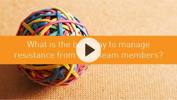 What is the best way to manage resistance from local team members?